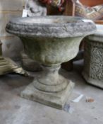 A reconstituted stone campana garden urn, diameter 50cm, height 48cm