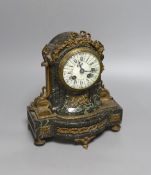 A 19th century French gilt metal mounted serpentine mantel clock,23cms high.