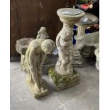 A reconstituted stone figural sundial, a female bather figure, bird bath and one other garden