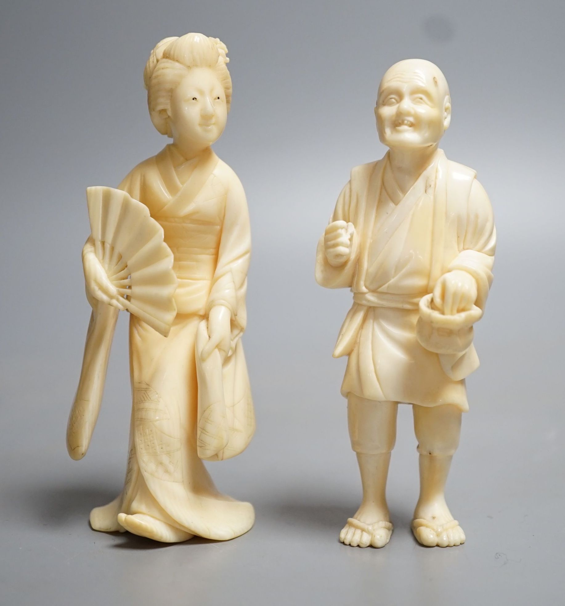 Two Japanese ivory figures of a man and a bijin, Meiji period, tallest signed to base, 10cm