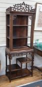 A Chinese hongmu cabinet on stand , circa 1900, lacking glazing, width 63cm, depth 35cm, height