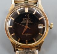 A gentleman's steel and gold plated Omega Automatic Constellation black dial wrist watch, on