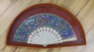 A Chinese pierced ivory and painted paper leaf fan, framed, fan 50cm wide