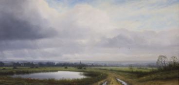 John Foulger (1943-2007), oil on canvas, Open riverscape with cattle and church in the distance,