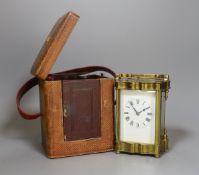 A cased brass repeating carriage clock, in case,12 cms high.