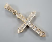 A modern 9ct gold and diamond set cross pendant, overall 4cm, gross weight 3 grams.