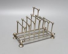 A late Victorian silver plated graduated seven bar toastrack, in the manner of Christopher