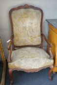 A pair of French carved walnut fauteuils with tapestry upholstery, width 75cm, depth 62cm, height