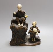 An ivory and wood figure group - 18.5cm tall