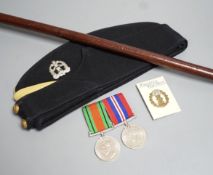 A WWII pair of medals, Middlesex Regiment cap and badge and WWI swagger stick.