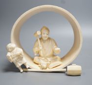 A Japanese ivory okimono of carpenter and child, Meiji period 15cm