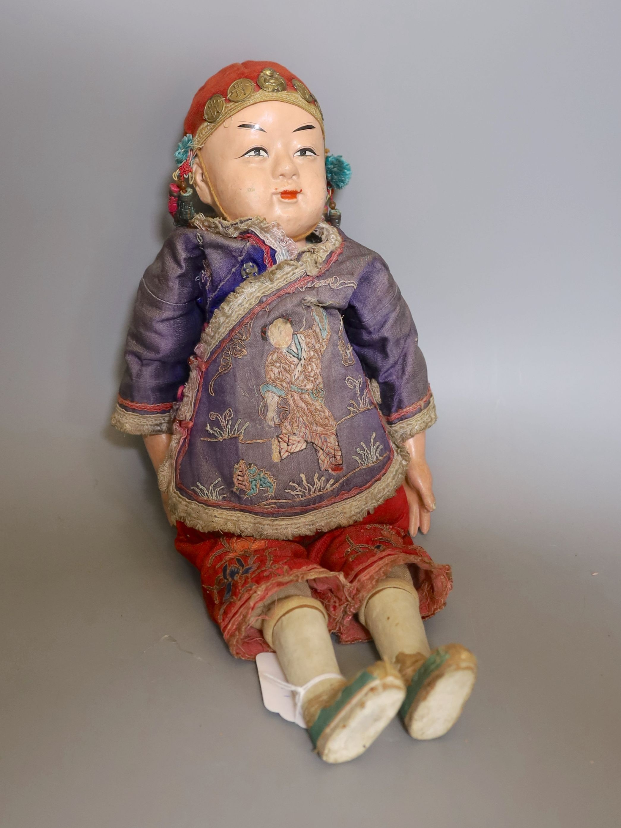 A papier mache doll, a Chinese boy in Chinese costume - 40cm high