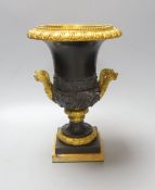 A Louis XVI style campana-shape bronze and ormolu urn, 28cm