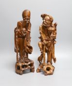 Two 19th century Chinese carved rootwood models of sages, 36cm