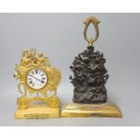 A gilt-metal Goliath pocket watch, in Empire-style watch-stand, 23cm high, and a lead-weighted