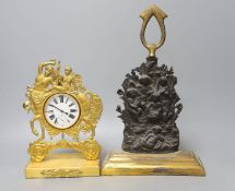 A gilt-metal Goliath pocket watch, in Empire-style watch-stand, 23cm high, and a lead-weighted