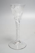 A Georgian air twist stem cordial glass, possibly later engraved with flowers and a butterfly,