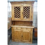 An 18th century and later French provincial pine dresser, width 114cm, depth 44cm, height 195cm