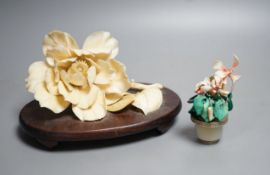 A Chinese ivory model of a peony flower on stand and a Chinese coloured ivory model of flowers