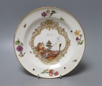 A mid-18th century Meissen topographical plate, insect and floral spray border, 23cm