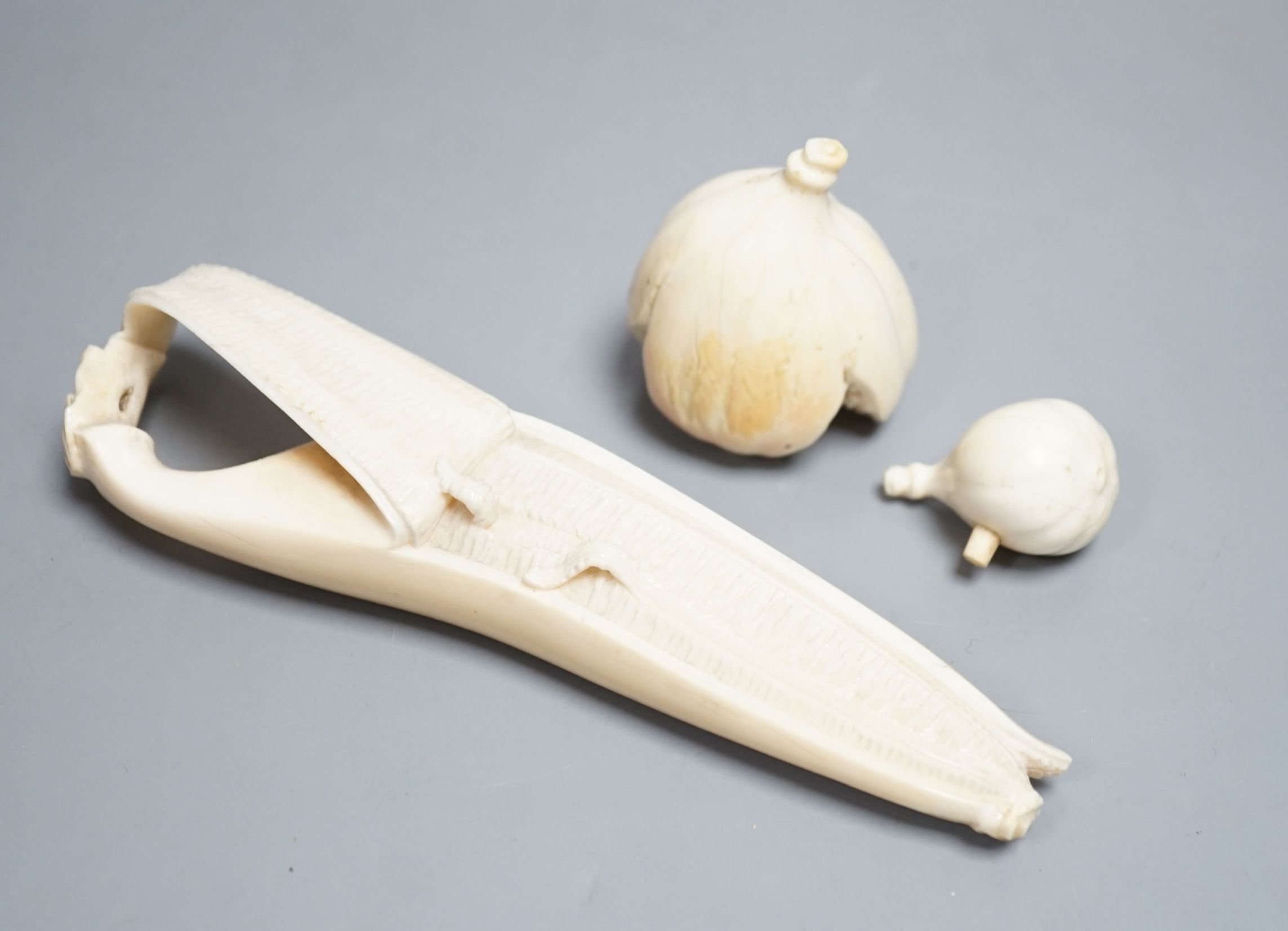 A Japanese ivory model of a partially peeled banana and an ivory model of figs, early 20th