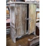 A small provincial pine two door cabinet