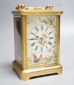 A late 19th century French brass carriage timepiece, the dial enamelled with chickens and foliage.