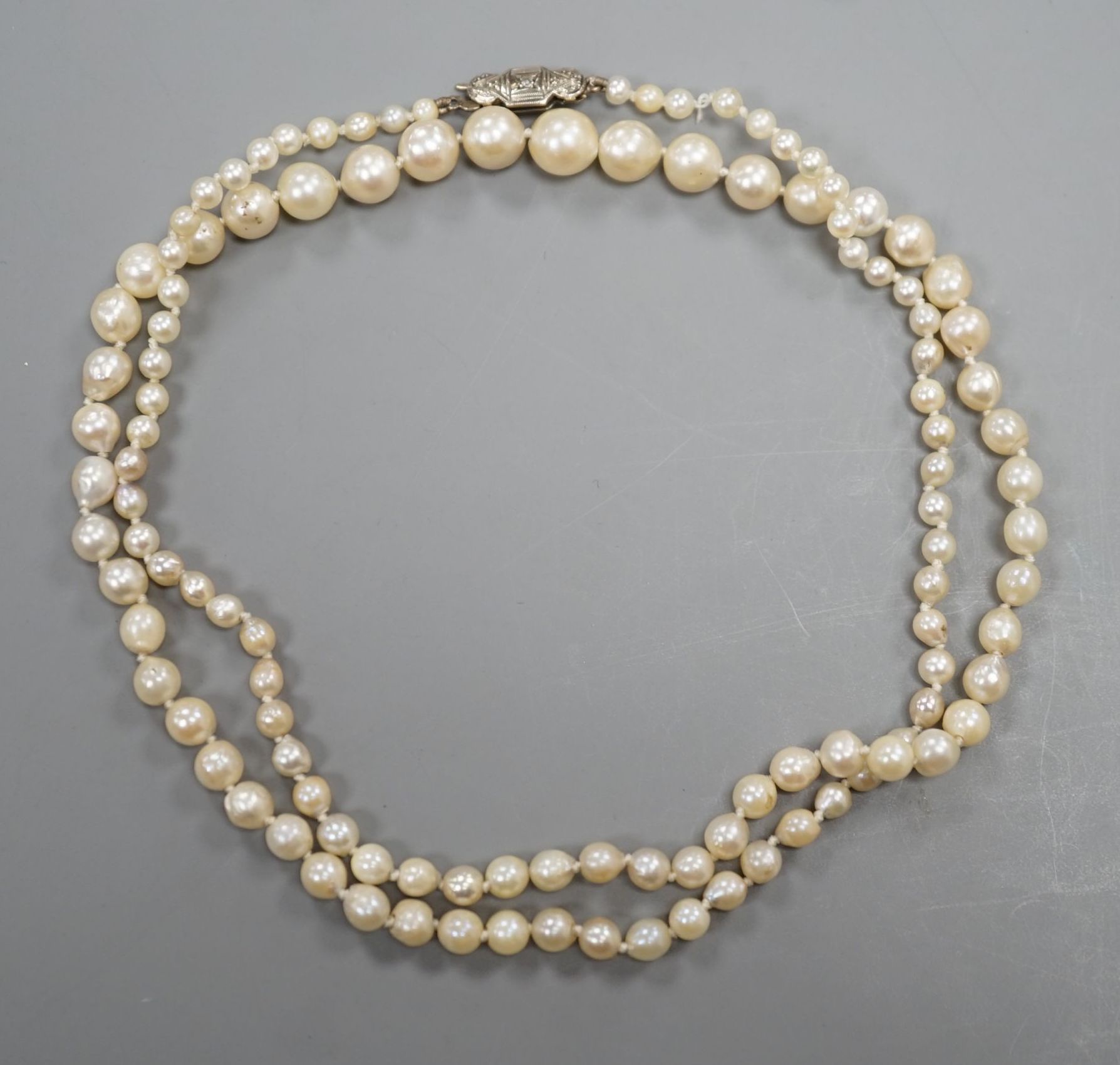 A single strand graduated cultured pearl necklace, with diamond chip set white metal clasp, 54cm,