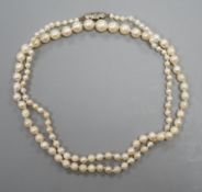 A single strand graduated cultured pearl necklace, with diamond chip set white metal clasp, 54cm,