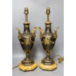 A pair of decorative brass and gilt ‘urn' lamps - 51cm tall