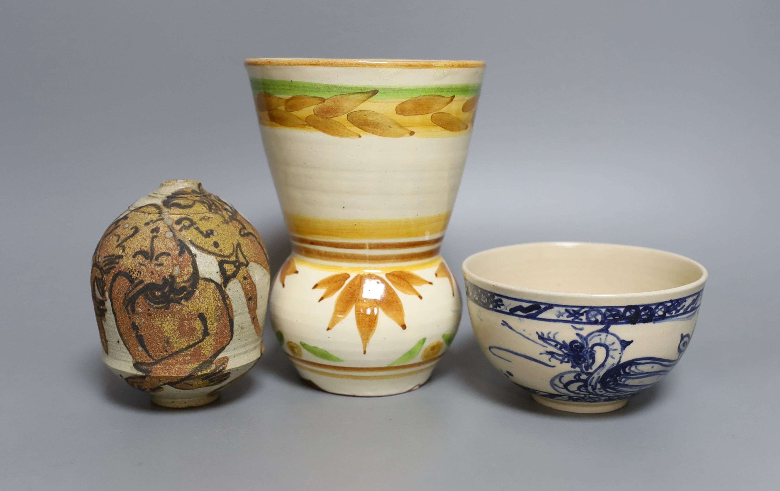 Three pieces of Yolande Beer pottery, to include a vase, ‘griffin’ bowl and a stoneware figural