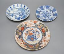 Three Chinese plates including a 19th century Chinese Imari dish, 23cm - repaired, a Chinese famille