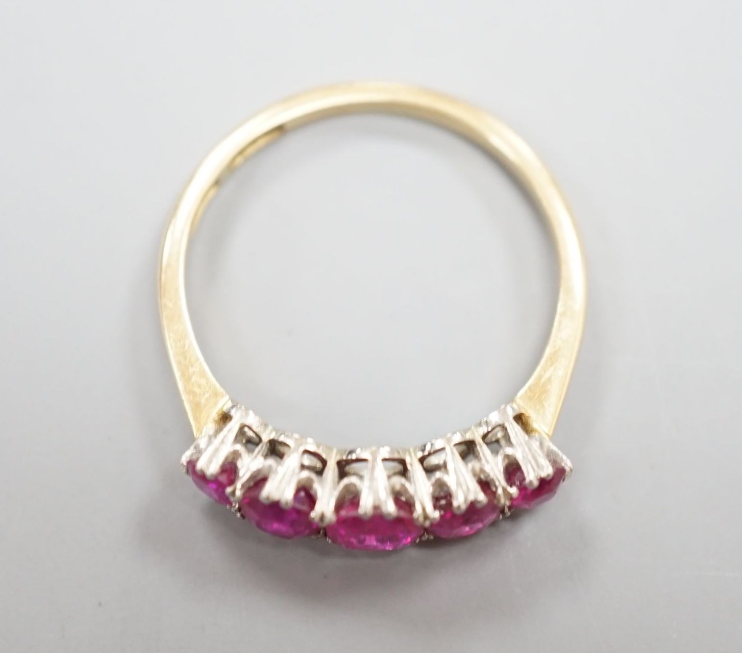 An early 20th century 18ct and plat, graduated five stone ruby set half hoop ring, size Q, gross - Image 2 of 3