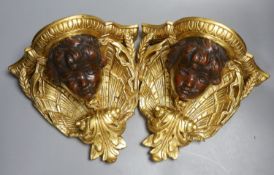 A pair of decorative gilt wall brackets - 26cm tall