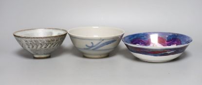 Two studio pottery bowls and a Chinese blue and white bowl, largest 18cm