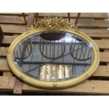 A late Victorian oval giltwood and gesso wall mirror, width 90cm, height 82cm