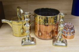 A Victorian copper jelly mould, pair of Victorian brass candlesticks 23cm, a brass water kettle, and