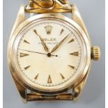 A gentleman's 1950's 9ct gold Rolex Oyster Precision manual wind wrist watch, with honeycomb dial