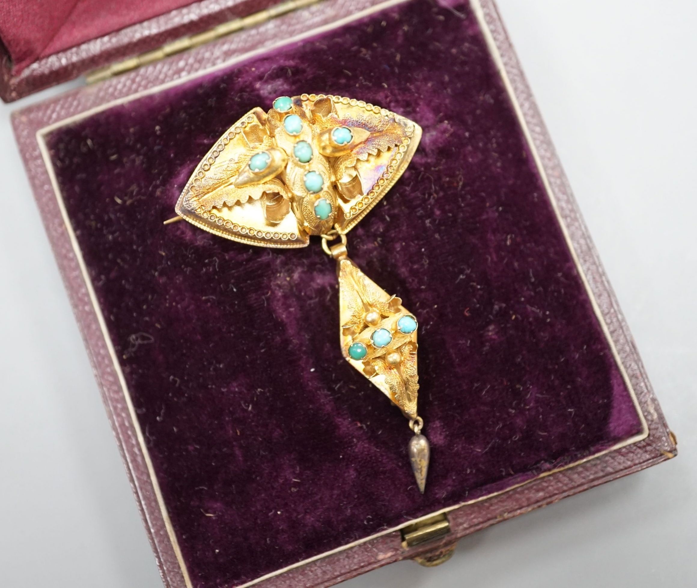A Victorian yellow metal and cabochon turquoise set drop brooch, in fitted leather box, 55mm,