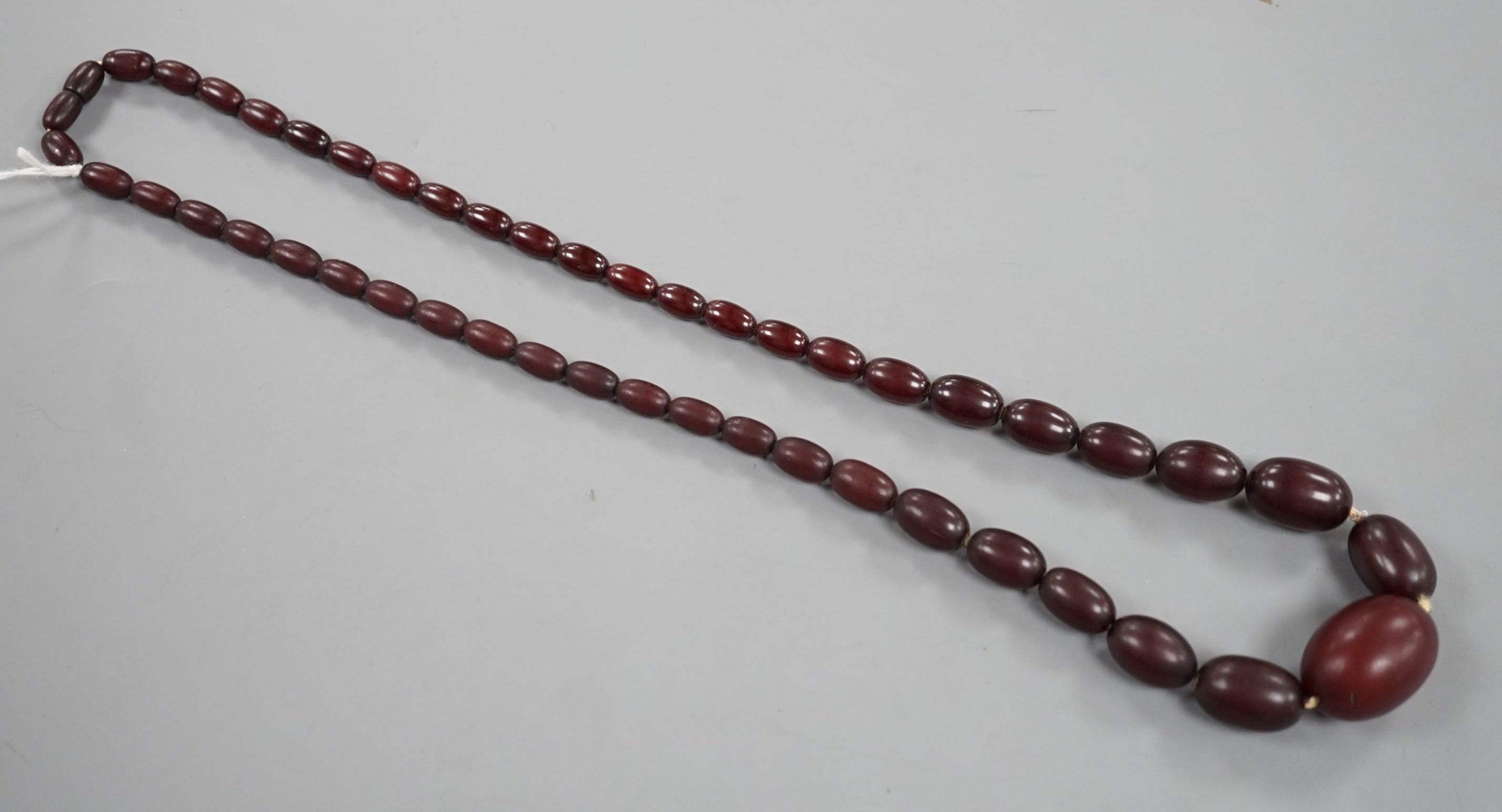 A single strand graduated oval bakelite bead necklace, 71cm, gross weight 60 grams. - Image 2 of 5