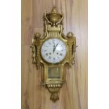 A decorative brass Cartel wall clock - 80cm tall