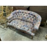 A mid Victorian mahogany framed buttoned two seater sofa, length 140cm, depth 80cm, height 80cm