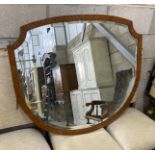 An Edwardian Sheraton style satinwood wall mirror