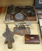 A box of curios including ship's log, brass projectile arrow and postal scales