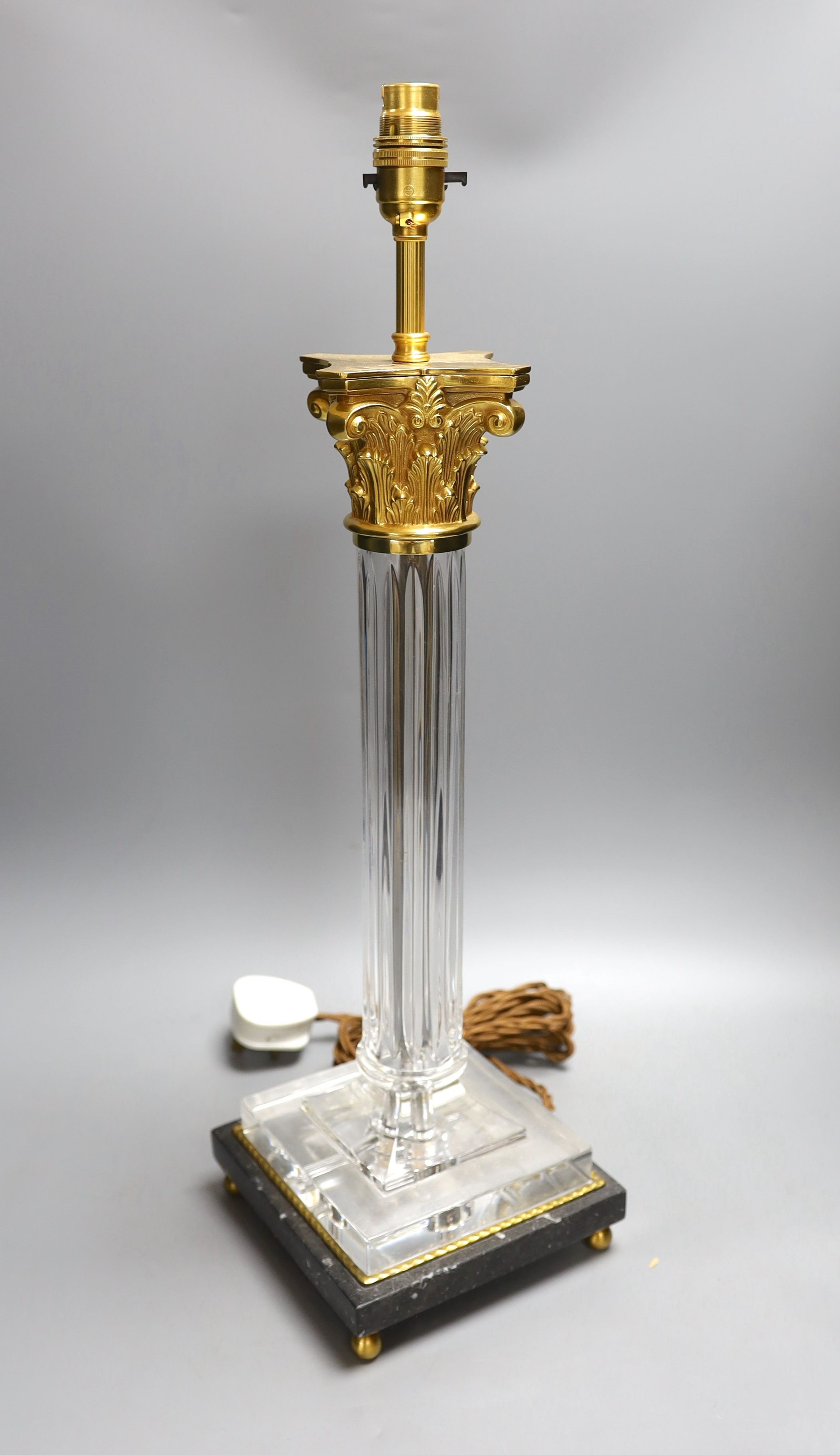 An ormolu and glass lamp - 58cm tall