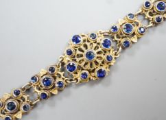 A late 19th/early 20th century Austro-Hungarian gilt white metal and blue paste set bracelet, 15.