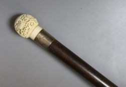 A 19th century carved Cantonese ivory top walking cane - 93cm high