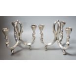 A pair of early 20th century German 835 white metal three light scroll arm candelabra, by Lutz &