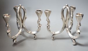 A pair of early 20th century German 835 white metal three light scroll arm candelabra, by Lutz &