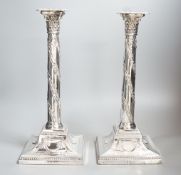 A pair of George V silver Corinthian column candlesticks, with spiral harebell columns, Ellis &
